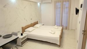 Postel nebo postele na pokoji v ubytování Constantine Fortezza Rooms