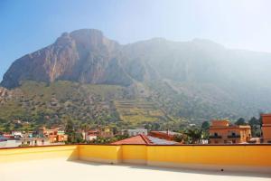 a view of a mountain from the roof of a building at Spacious family appart.+ panoramic view near beach in Cinisi