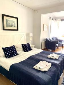Postel nebo postele na pokoji v ubytování Hotell Kaprifol