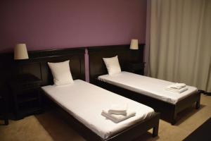 Postel nebo postele na pokoji v ubytování Hotel Condor