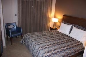 Posteľ alebo postele v izbe v ubytovaní Hotel Cariatis