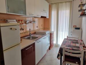 A kitchen or kitchenette at Casa Lido Piccolo Még 13 kép
