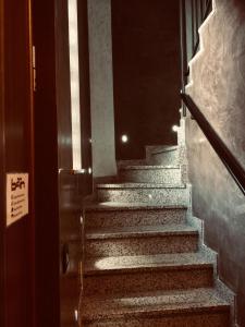 a stairway with stairs leading up to a building at B2In Suite & Office in Capriate San Gervasio