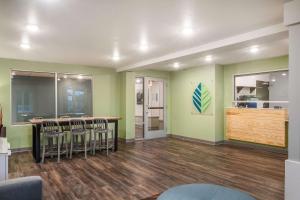 a room with a bar with stools in it at WoodSpring Suites Atlanta Newnan in Newnan