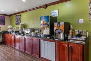 a kitchen with a counter with a coffee maker at Sleep Inn & Suites in Brunswick