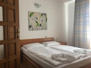 Postel nebo postele na pokoji v ubytování Mellys Haus