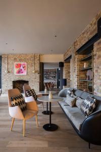 a living room with a couch and a table at Zanzibar Locke in Dublin