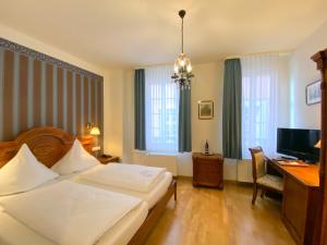 Cama o camas de una habitación en Hotel Rathausglöckel
