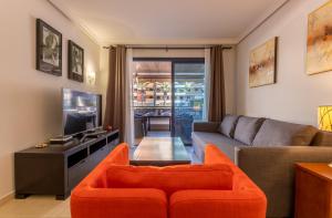 A television and/or entertainment centre at Balcon de Los Gigantes 2A016