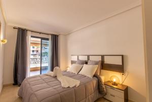 A bed or beds in a room at Balcon de Los Gigantes 2A016 Még 21 kép