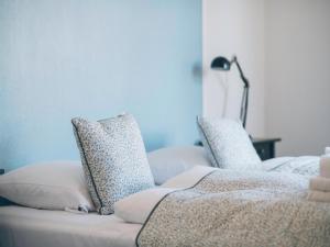 Säng eller sängar i ett rum på Hotel Faaborg