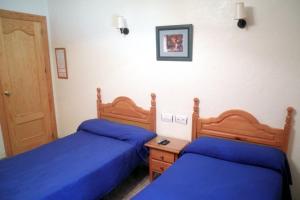 Postel nebo postele na pokoji v ubytování Hostal Delfin Verde
