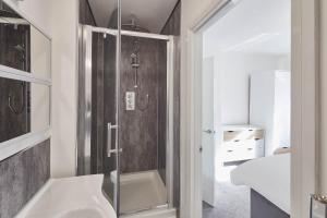 a bathroom with a shower and a sink at Host & Stay - Dacama at Dene Grove in Darlington