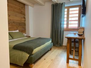 Ένα ή περισσότερα κρεβάτια σε δωμάτιο στο B & B Chalet Plan