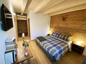 Ένα ή περισσότερα κρεβάτια σε δωμάτιο στο B & B Chalet Plan