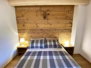 Ένα ή περισσότερα κρεβάτια σε δωμάτιο στο B & B Chalet Plan