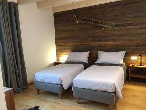 Ένα ή περισσότερα κρεβάτια σε δωμάτιο στο B & B Chalet Plan