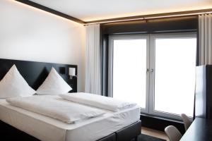 Postel nebo postele na pokoji v ubytování KL Hotel by WMM Hotels