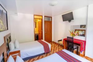 Voodi või voodid majutusasutuse Hotel Machupicchu Inn toas