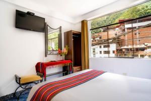 Voodi või voodid majutusasutuse Hotel Machupicchu Inn toas