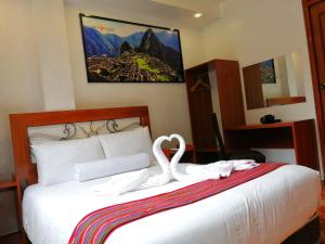 Voodi või voodid majutusasutuse Hotel Machupicchu Inn toas