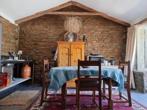 a dining room with a table and two chairs at Perlman House in Sutherland