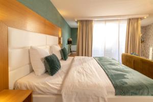 Postel nebo postele na pokoji v ubytování Van der Valk Hotel Beveren