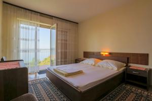 Posteľ alebo postele v izbe v ubytovaní Bela Apartments + 32 fotografií