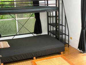 Postel nebo postele na pokoji v ubytování Ishigakijima Guesthouse Seacoro