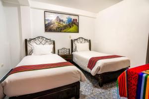 Voodi või voodid majutusasutuse Hotel Machupicchu Inn toas