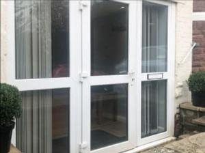 a white door with glass windows on a house at High gables Apartment 1 in Paignton