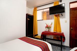 Voodi või voodid majutusasutuse Hotel Machupicchu Inn toas