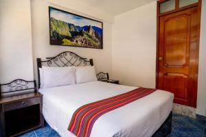 Voodi või voodid majutusasutuse Hotel Machupicchu Inn toas