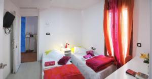 Łóżko lub łóżka w pokoju w obiekcie B&B Casa Alfareria 59