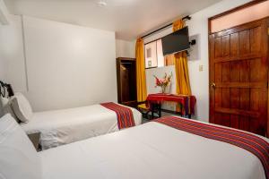 Voodi või voodid majutusasutuse Hotel Machupicchu Inn toas