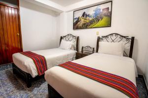 Voodi või voodid majutusasutuse Hotel Machupicchu Inn toas