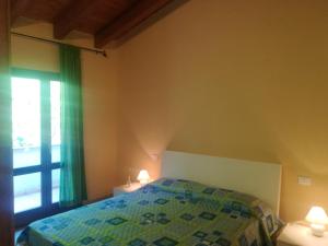 Letto o letti in una camera di One bedroom appartement at Castelsardo 500 m away from the beach with sea view furnished terrace and wifi