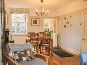 a kitchen and dining room with a table and chairs at Willow View in Shrewsbury