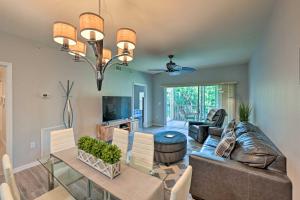 a living room with a couch and a table at Quiet Lely Resort Condo with Pool - 2 Mi to Golf! in Naples