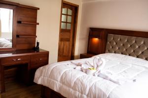 Postel nebo postele na pokoji v ubytování Hotel Imperial Zumbahua & Quilotoa Lodge