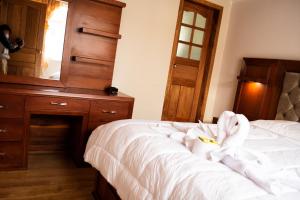 Postel nebo postele na pokoji v ubytování Hotel Imperial Zumbahua & Quilotoa Lodge
