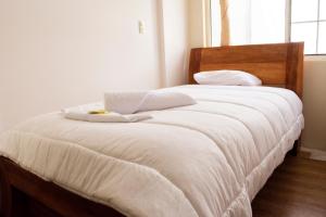 Postel nebo postele na pokoji v ubytování Hotel Imperial Zumbahua & Quilotoa Lodge
