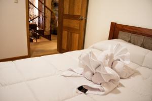 Postel nebo postele na pokoji v ubytování Hotel Imperial Zumbahua & Quilotoa Lodge