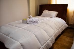 Postel nebo postele na pokoji v ubytování Hotel Imperial Zumbahua & Quilotoa Lodge