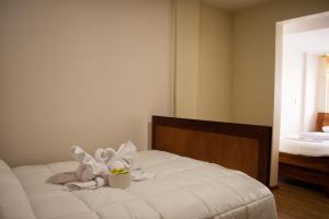 Postel nebo postele na pokoji v ubytování Hotel Imperial Zumbahua & Quilotoa Lodge