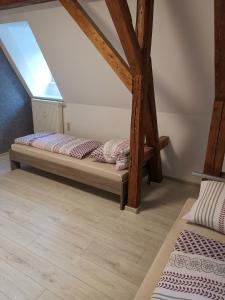 a room with two beds in the attic at Ferienwohnung Rote-Villa in Pobershau
