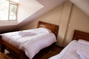 Postel nebo postele na pokoji v ubytování Hotel Imperial Zumbahua & Quilotoa Lodge