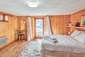 Postel nebo postele na pokoji v ubytování Le Chalet des Neiges - Welkeys