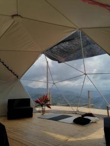 a room with a large tent with a view at Domo Glamping Kalpavriksha - Jostcolombia in La Vega