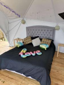 Postel nebo postele na pokoji v ubytování Domo Glamping Reserva Los Cucharos